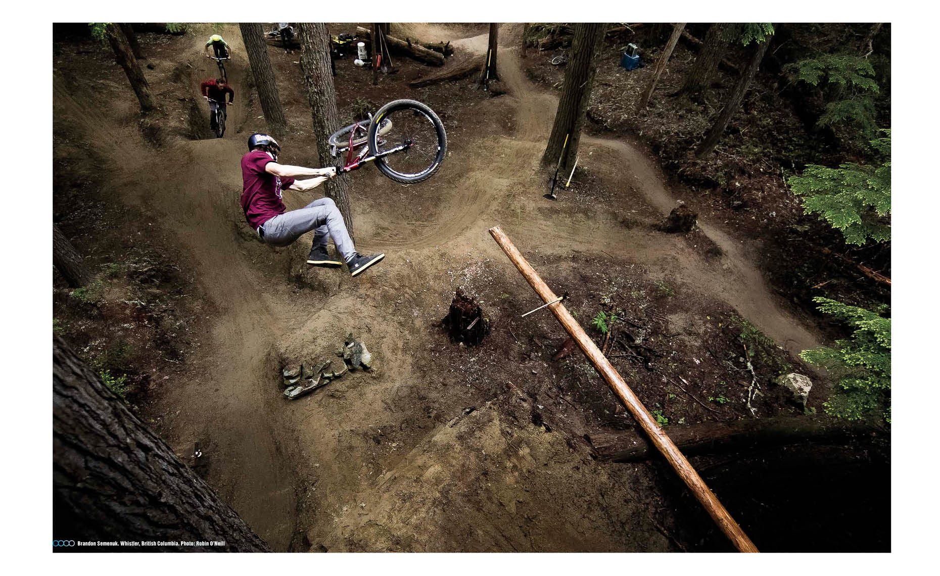 Brandon Semenuck bike jump in whistler forest overhead shot